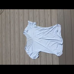 Slightly see through light blue tee.